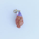 This adorable charm of a delicious ube soft serve ice cream served in a taiyaki cone handmade with polymer clay, hand painted with acrylic paint, and coated in resin. Made to last! This charm can be used on a charm bracelet, necklace chain, or as a keychain on bag zipper to give your outfit a pop of sugar to show your sweet side.